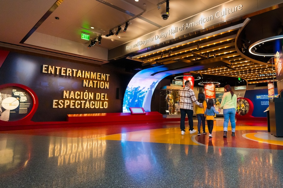 A family enters the Entertainment Nation exhibit at the National Museum of American History.