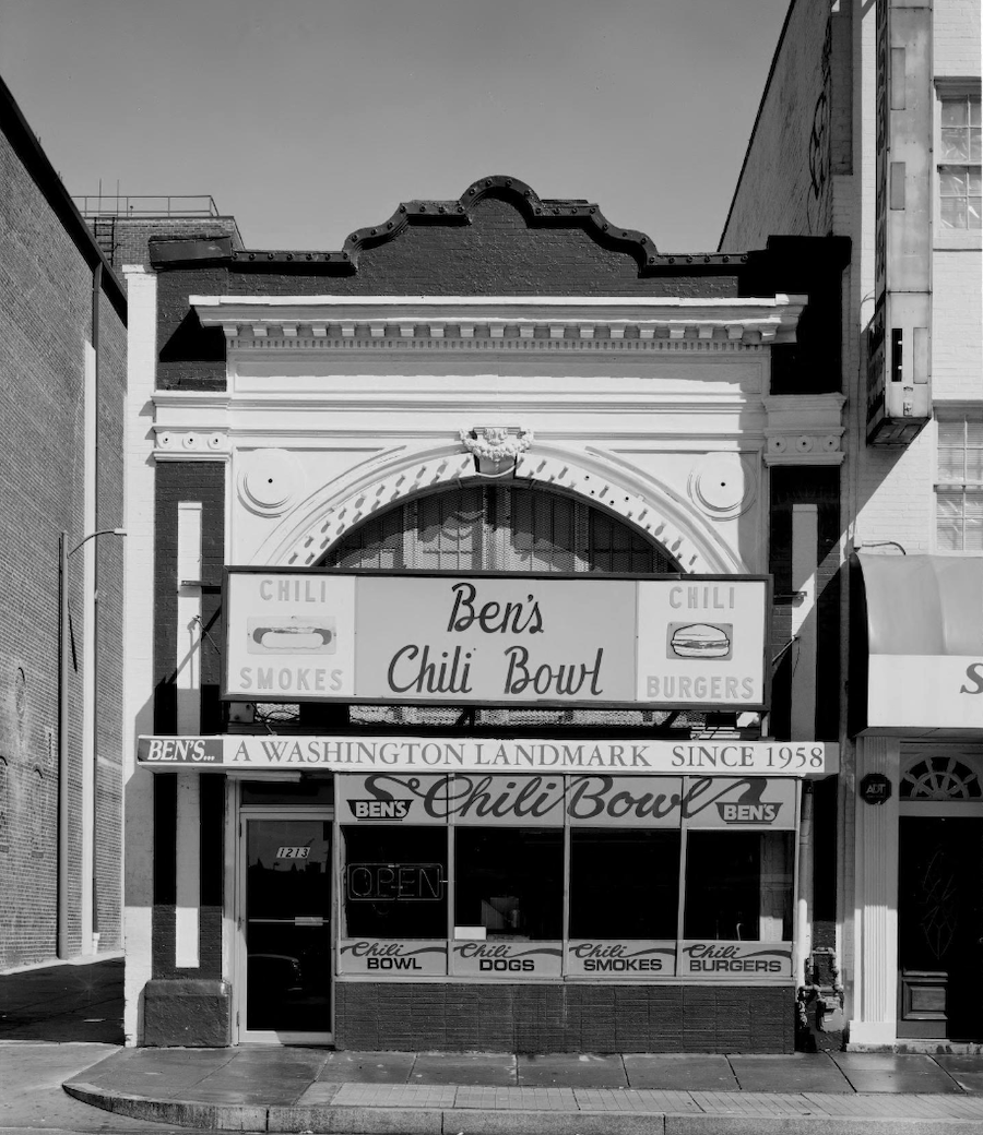 Black-and-white photo of the Ben’s Chili Bowl restaurant exterior in Washington, DC, with its iconic signage.