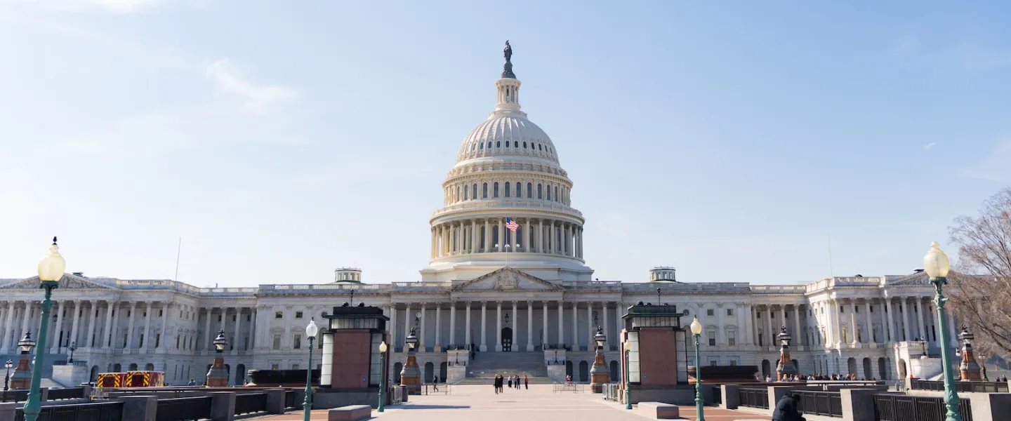 The U.S. Capitol building in Washington, DC, viewed from the plaza on a clear day.