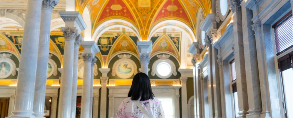 Person standing inside the Library Of Congress