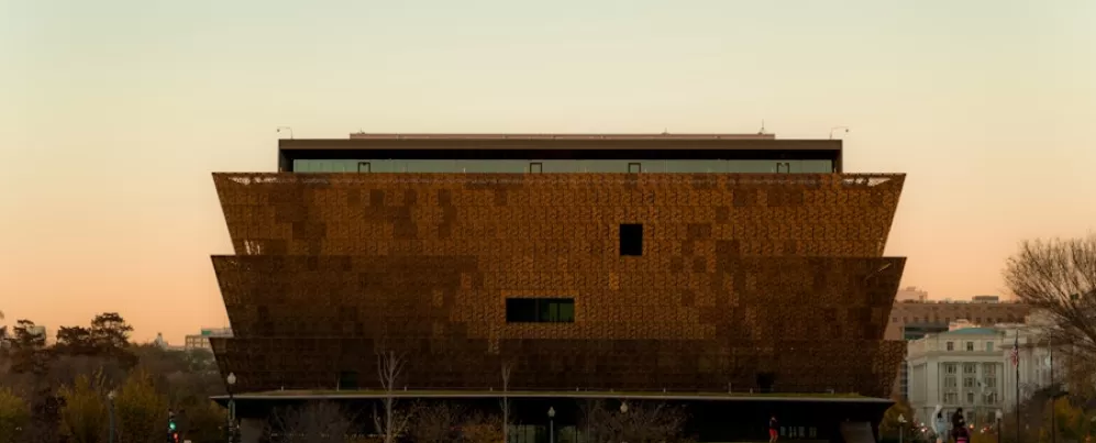 The National Museum of African American History and Culture in Washington, DC, at sunset.