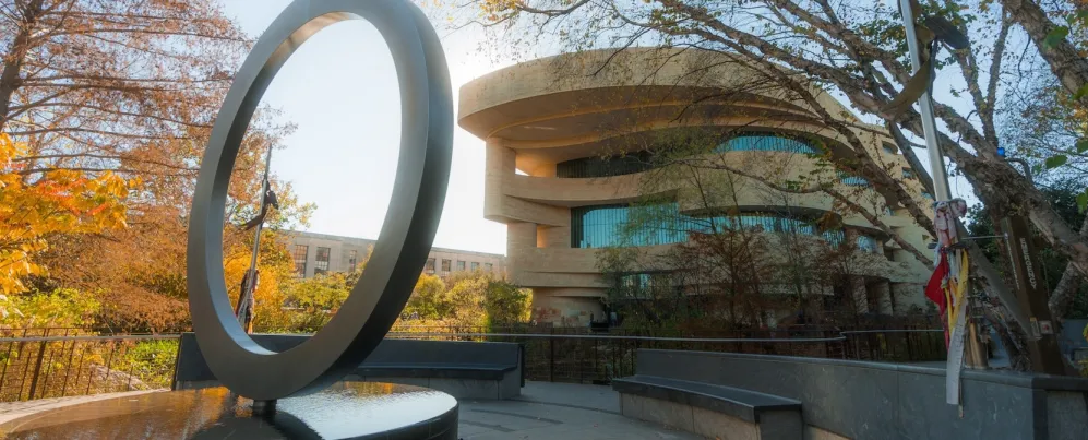 The National Native American Memorial with the National Museum of the American Indian behind