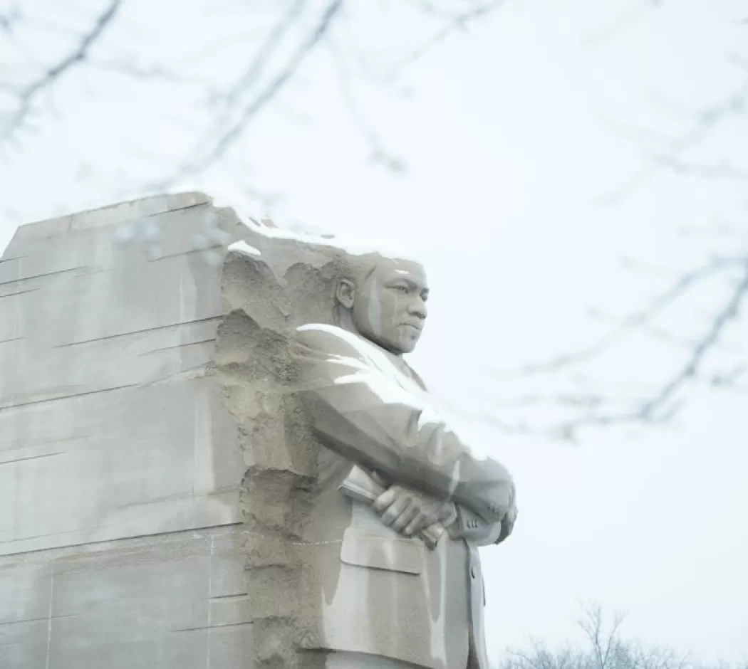 The Martin Luther King Jr. Memorial stands majestic with a light covering of snow in Washington, DC.